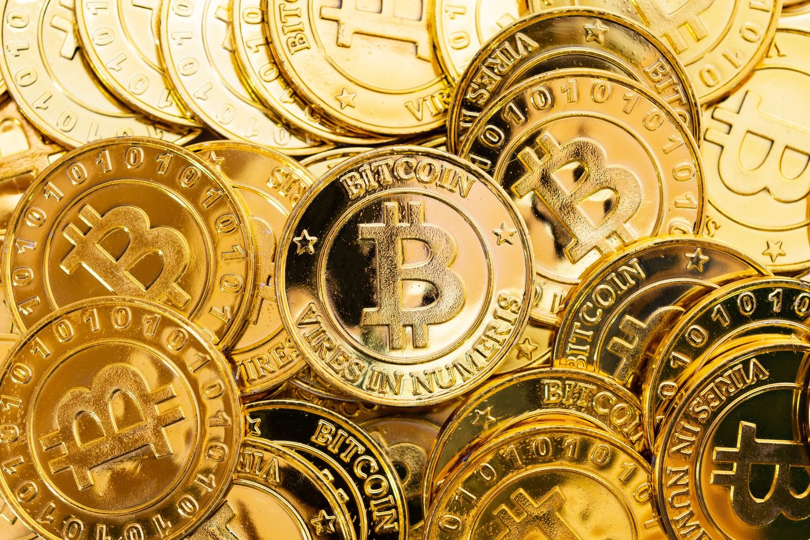 A pile of gold Bitcoin coins