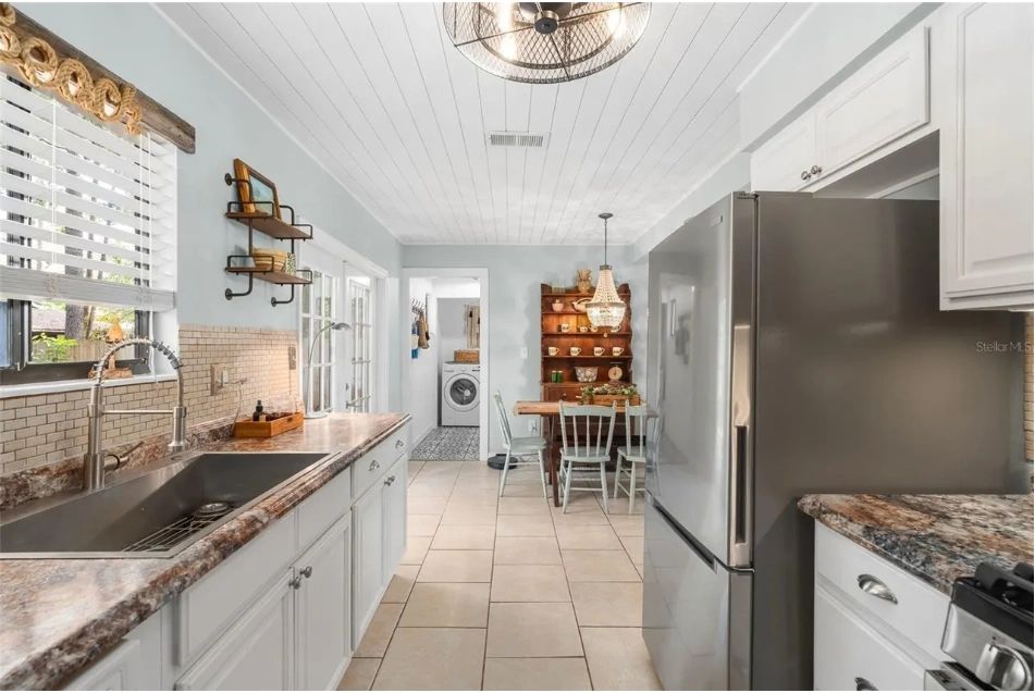 Cottage-style galley kitchen in the blue-gray Gainesville home
