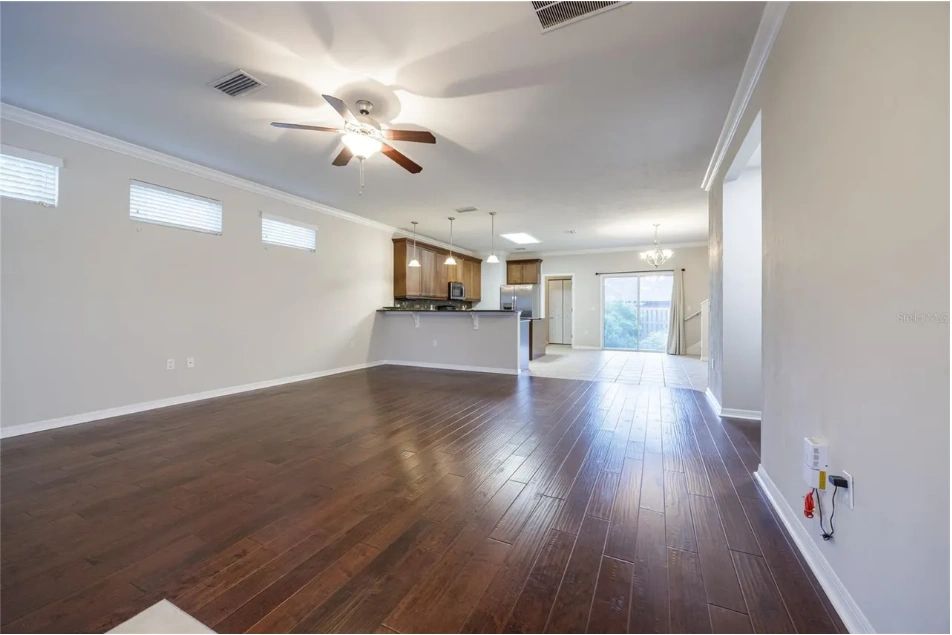Vacant staged living room in the gray craftsman Gainesville home